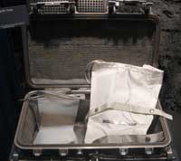A case used for the transport of lunar samples between the Moon and Earth during the Apollo programme. Inside the case are several sample collection and containment bags, used on the surface for initial sample collection and sorting. These items are on display at the National Museum of Natural History in Washington, DC, USA.