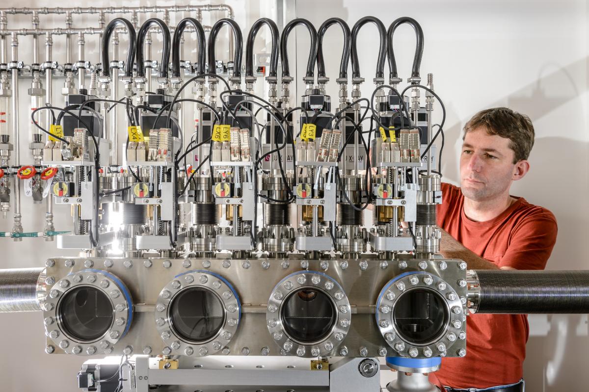 An engineer works on the compound refractive lens (CRL) unit of an instrument at European XFEL.