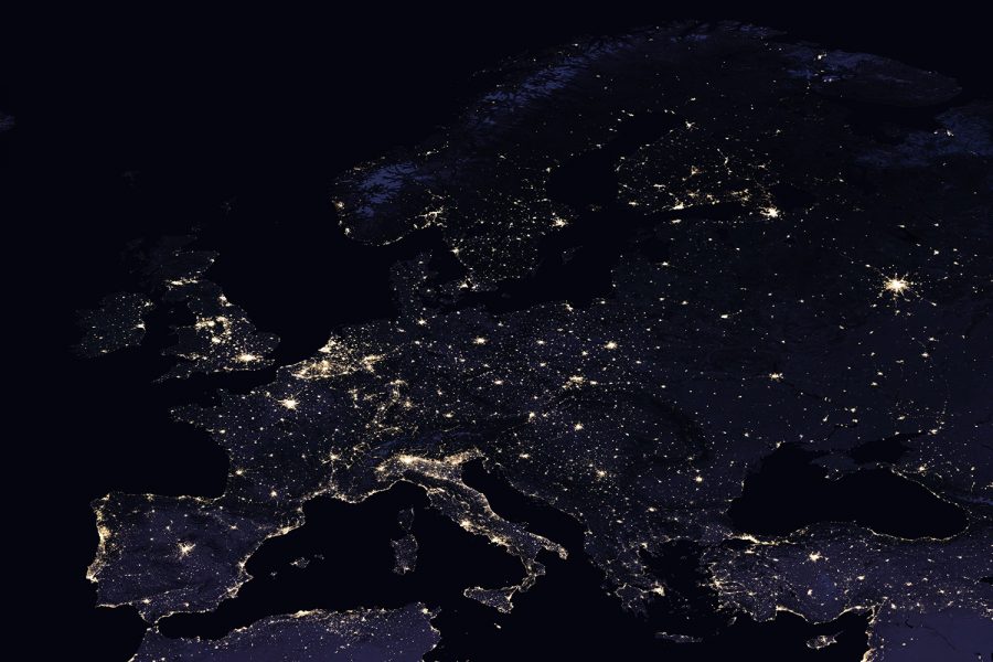 Europe at night as seen from space. Big cities, densely populated areas, and coastlines are brightly illuminated.