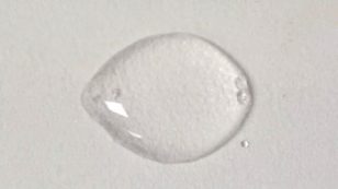 A transparent solvent drop after the grains have dissolved.