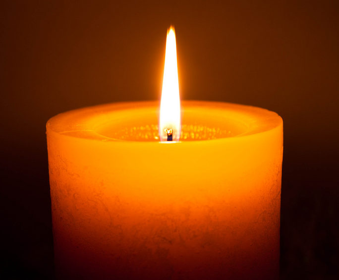 The light emitted by a single candle is roughly equal to one candela, the SI unit of luminosity.