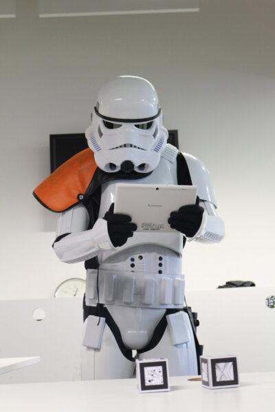 A demonstrator dressed as a stormtrooper using the acceleratAR app on a tablet.