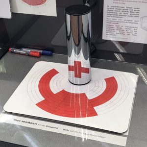 Exploring anamorphosis: revealing hidden images with mirrors ...